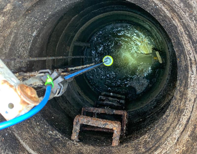 The VEGAPULS C 21 radar sensor in a wastewater lift station uses a blue cable to signify Intrinsically Safe Approvals